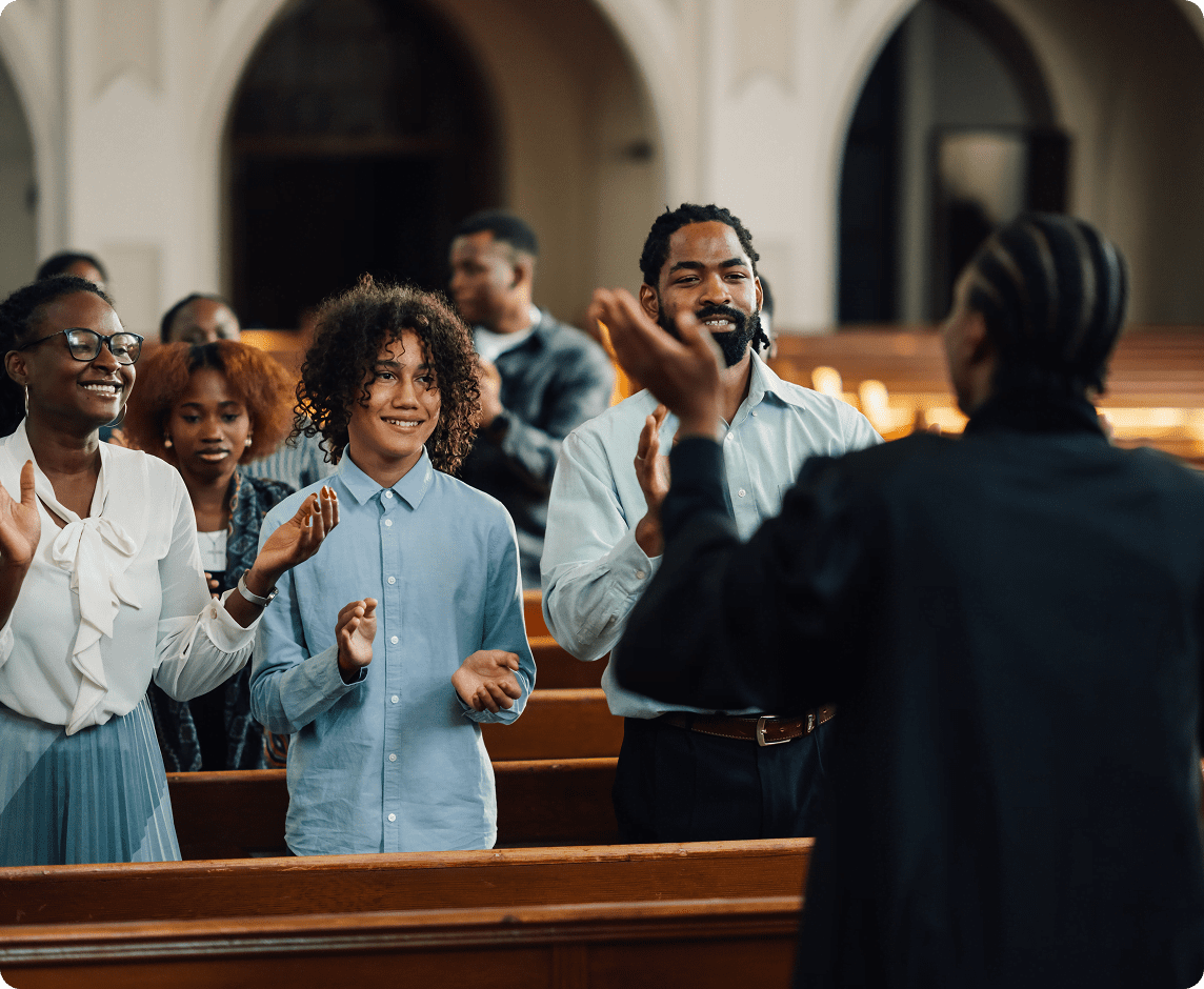 People clapping during a church service.